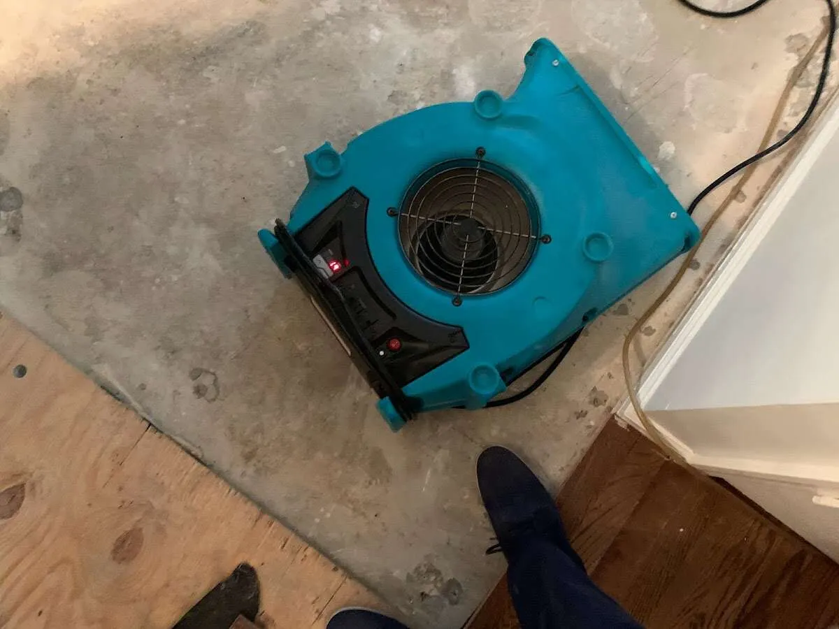 Air mover drying subfloor during Leak Detection & Repair in Pocono